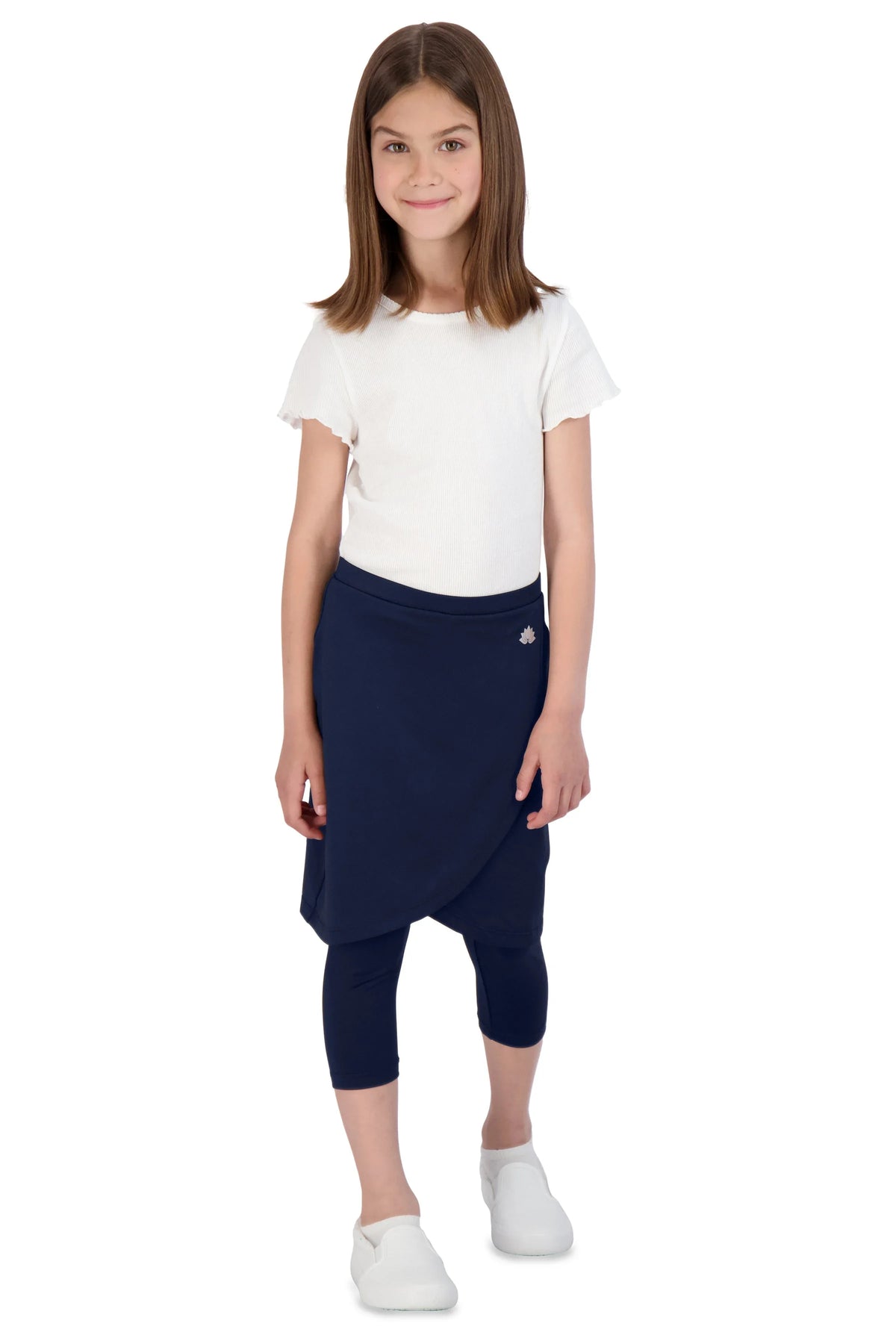 Girl wearing Snoga Athletics navy faux wrap tennis skirt with attached leggings