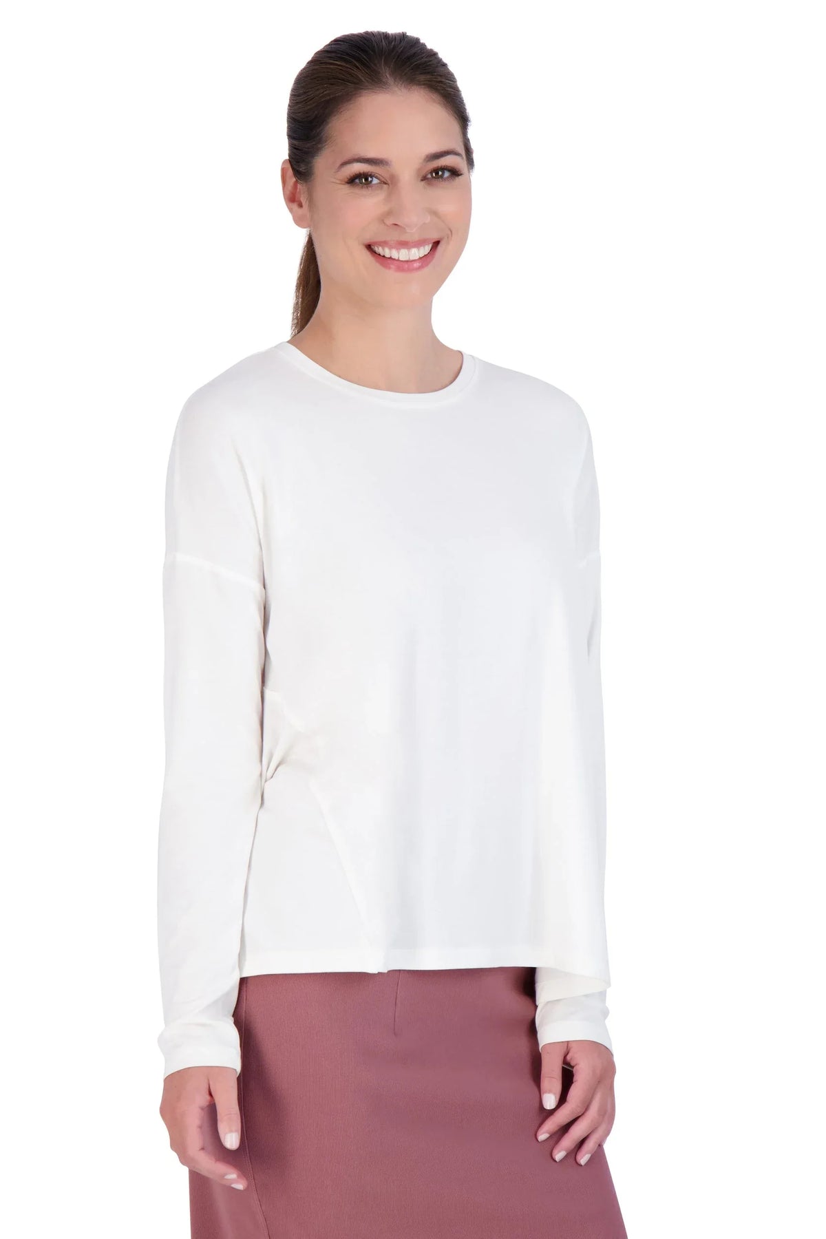Woman wearing Snoga Athletics white long sleeve modest athletic tee and mauve skirt