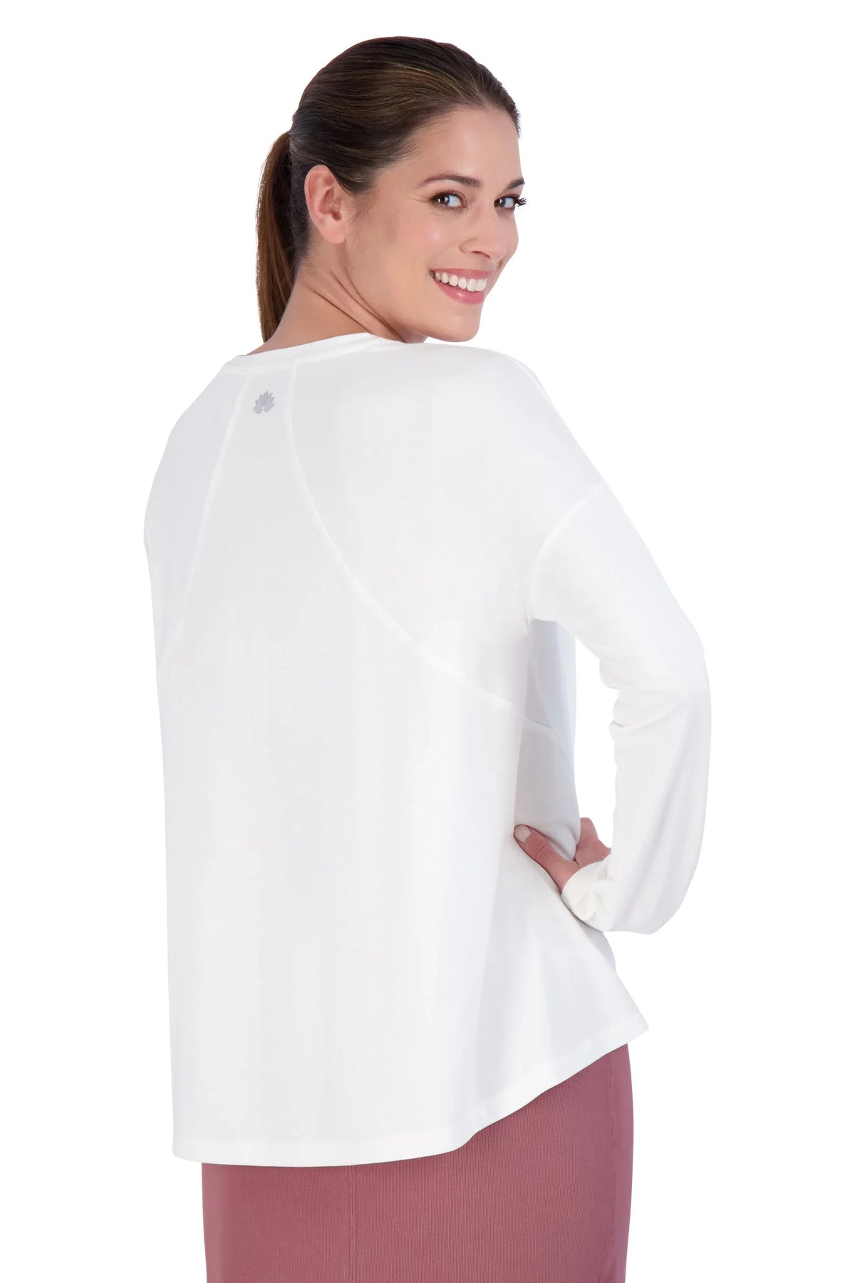 Woman modeling Snoga Athletics long sleeve white tee, modest activewear, back view