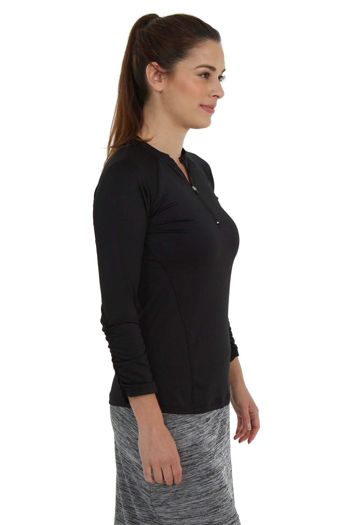 Woman wearing a black Snoga Athletics long sleeve active top with half-zip