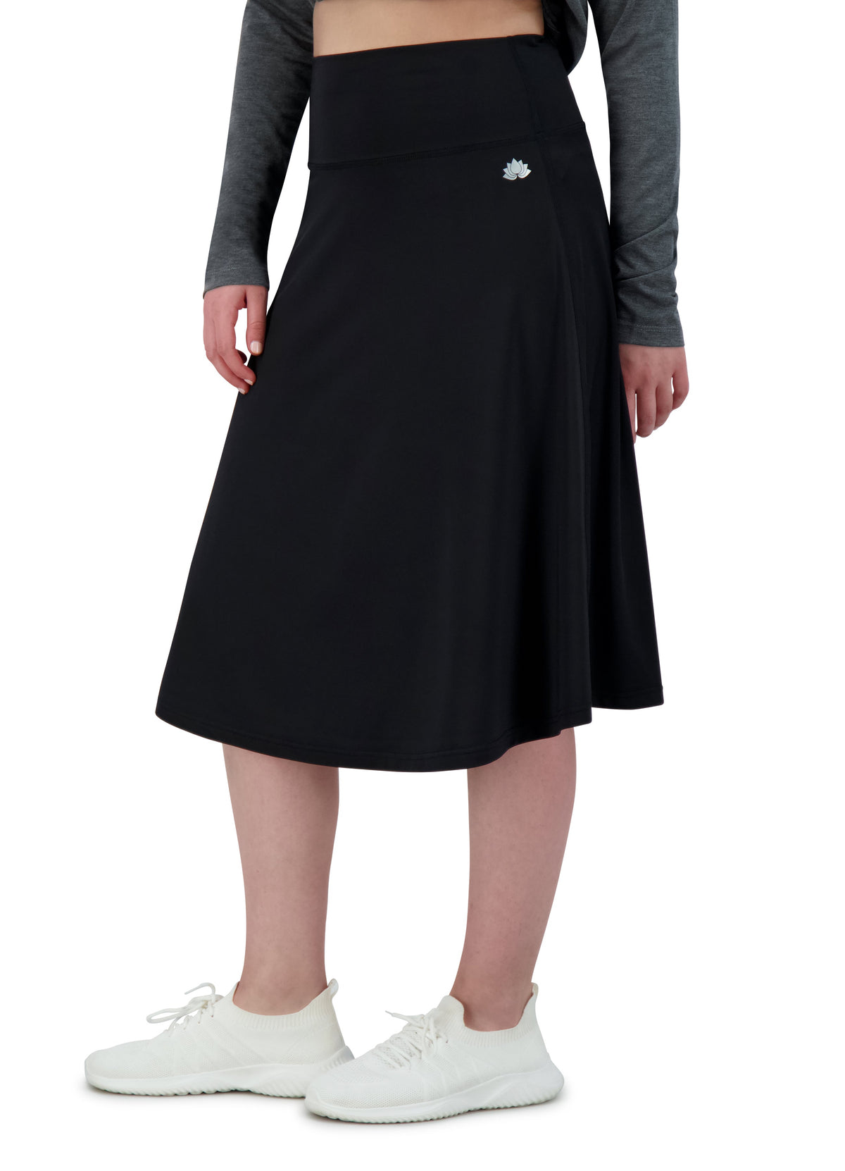 Snoga Athletics lightweight black modest athletic skirt with zipper pocket, worn by a woman