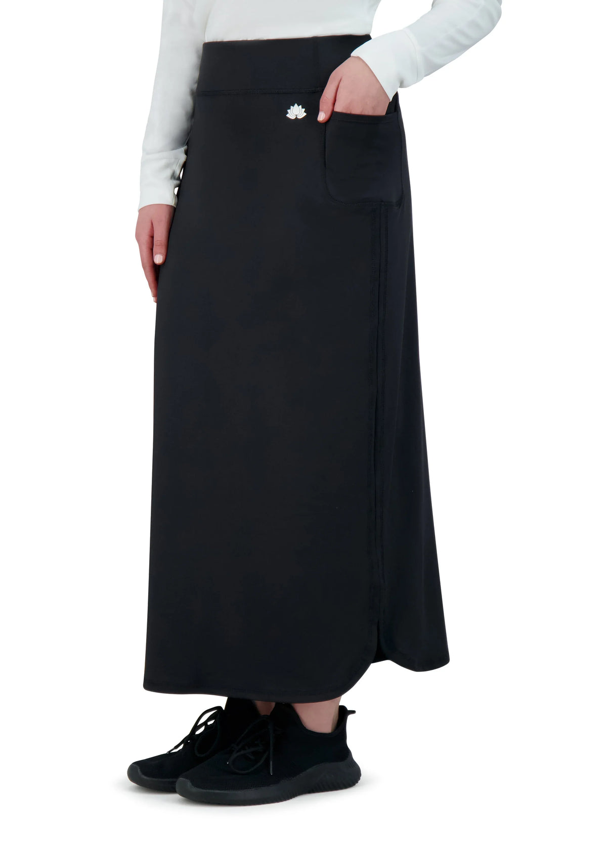 Snoga Athletics black maxi active skirt with side pocket, worn with sneakers