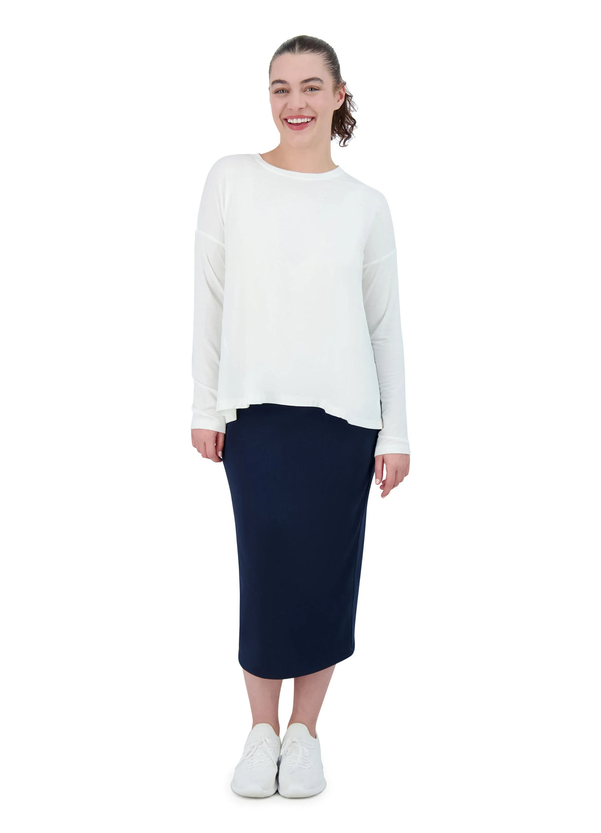 Woman modeling Snoga Athletics navy ribbed stretch pencil skirt with white long sleeve top