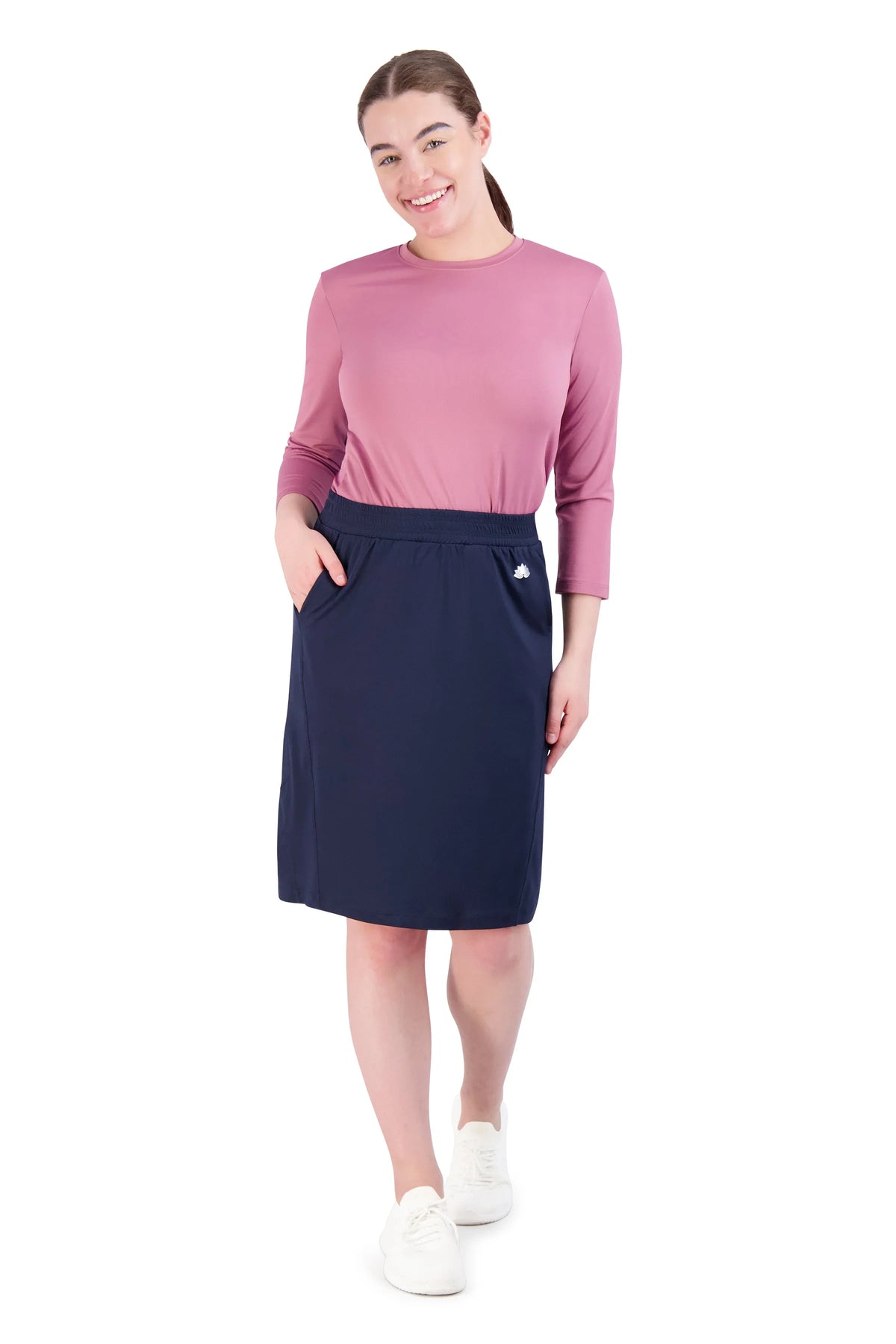 Woman wearing Snoga Athletics navy blazer travel skirt with pockets and casual top
