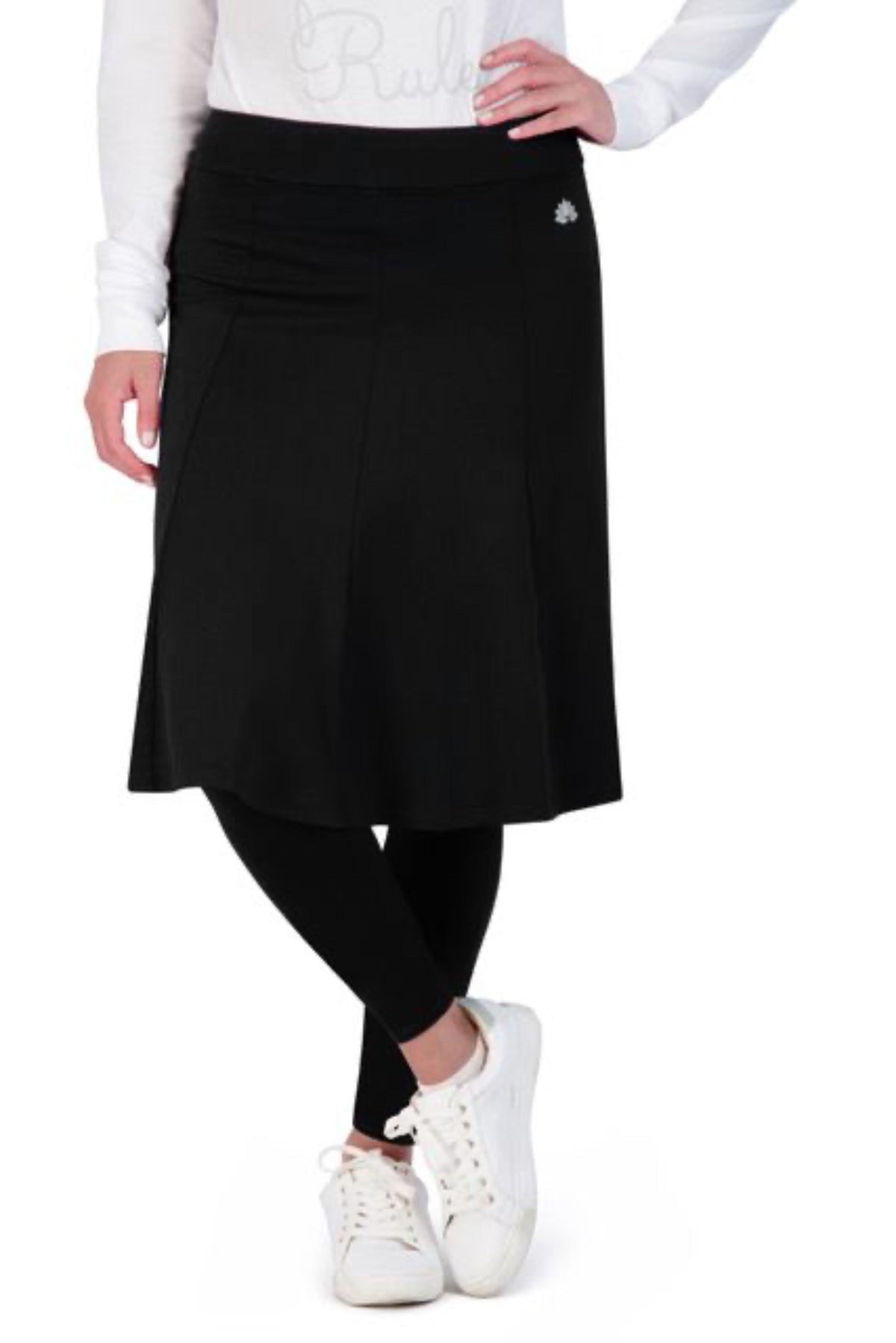 Snoga Athletics black skirted leggings with ankle-length fit, worn with white sneakers