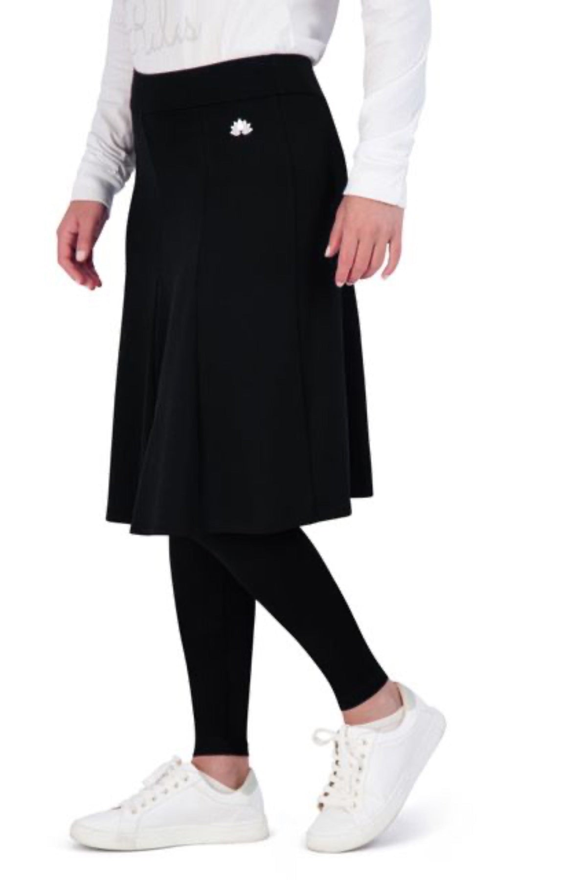 Snoga Athletics black modest skirt with attached leggings, white logo, and white sneakers
