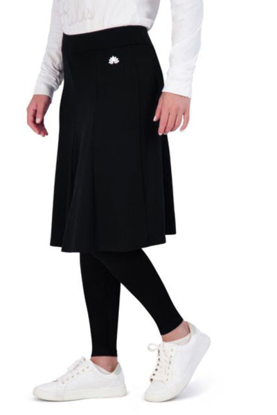 Snoga Athletics black modest skirt with attached leggings, white logo, and white sneakers