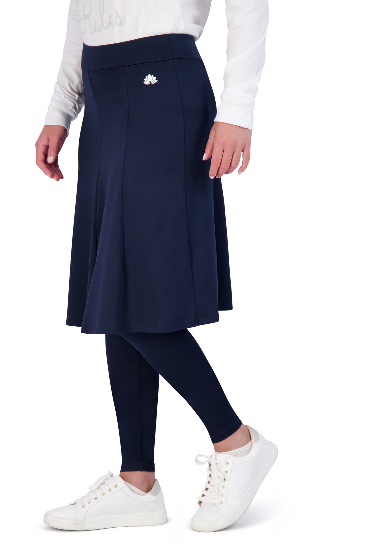 Snoga Athletics navy blue modest skirt leggings with lotus logo, styled with white sneakers