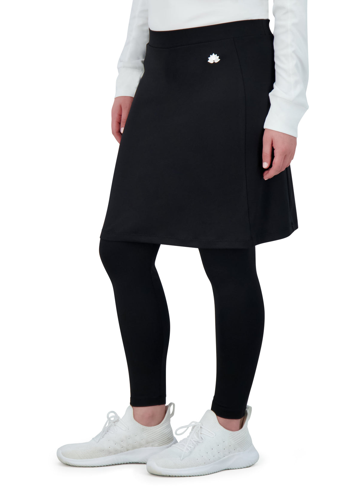 Woman wearing Snoga Athletics black ankle-fit modest skirt leggings with white sneakers