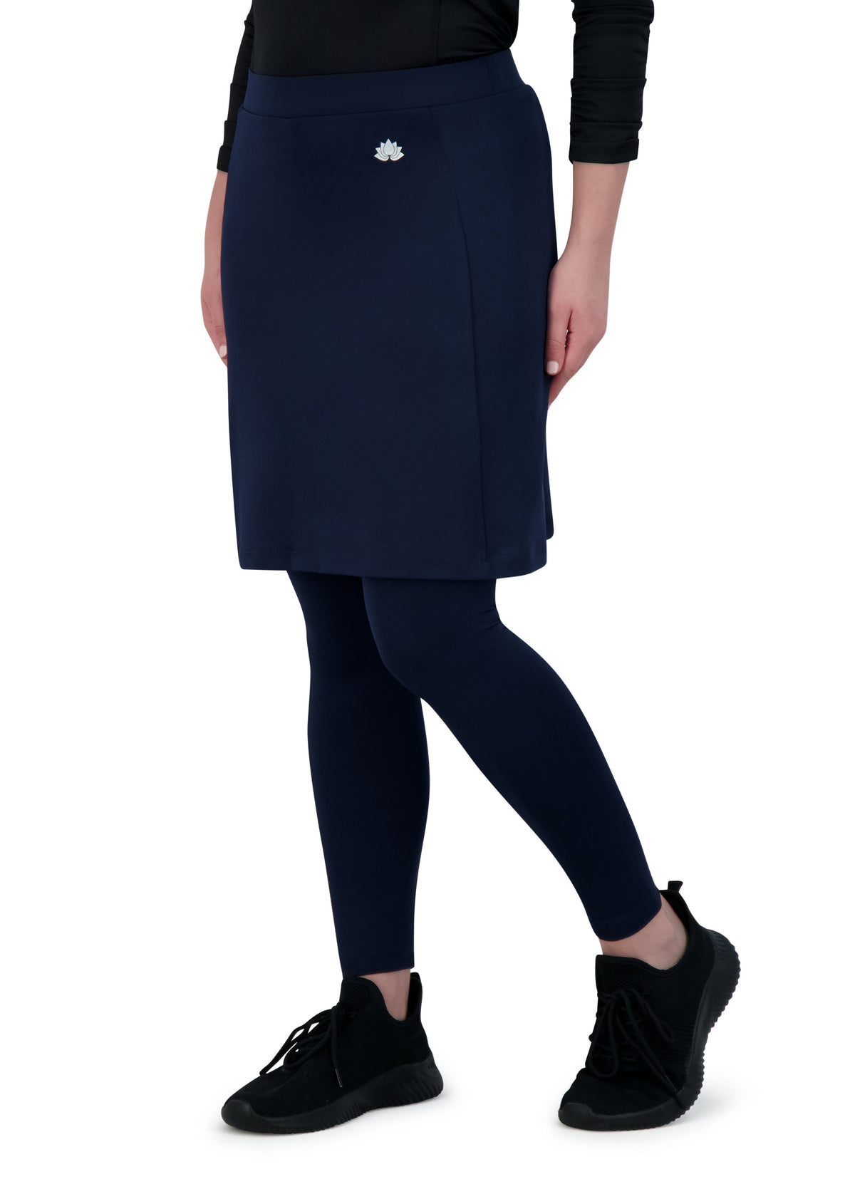 Woman wearing Snoga Athletics navy ankle-fit modest skirt with leggings and black sneakers