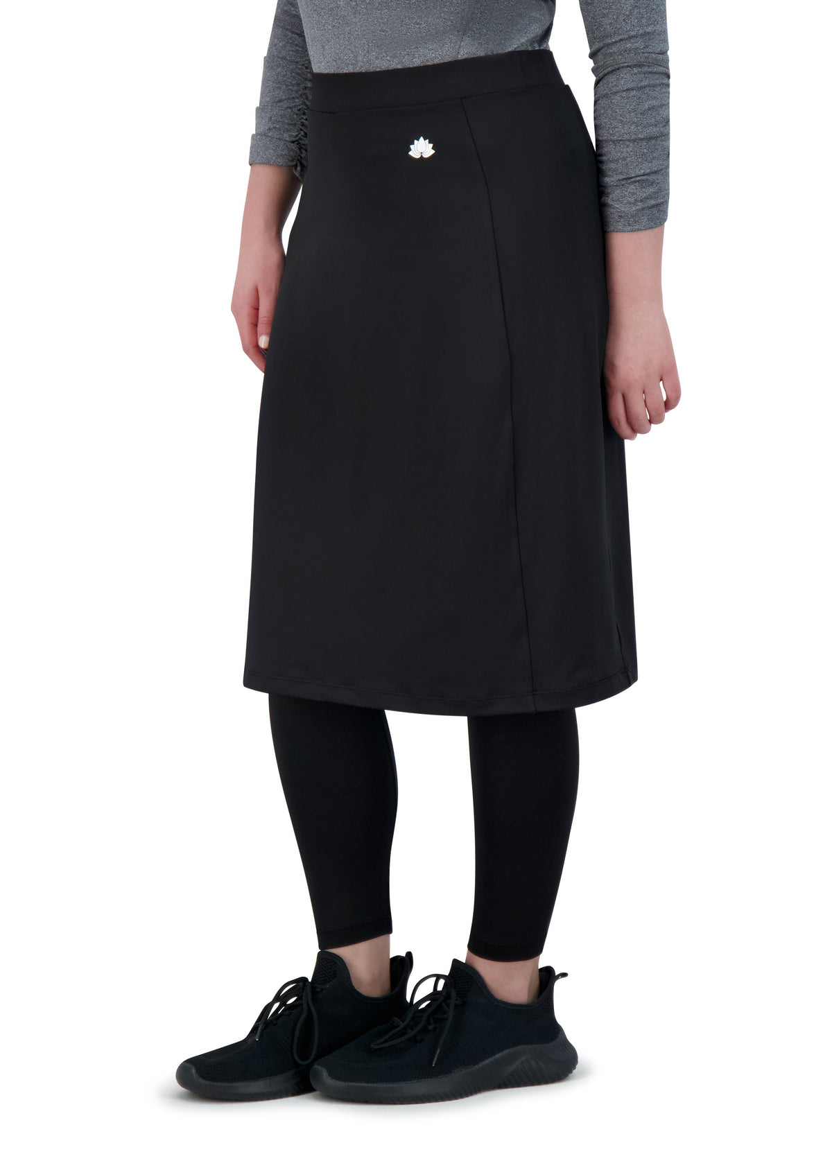 Snoga Athletics black modest ankle-fit skirt leggings, side view on model