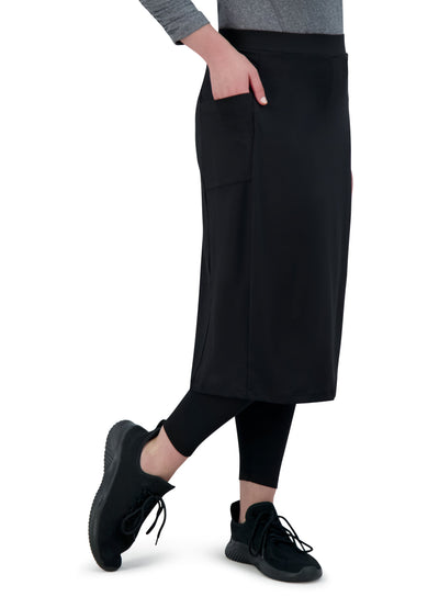 Snoga Athletics black ankle-fit modest skirt with pockets, shown with black leggings and sneakers