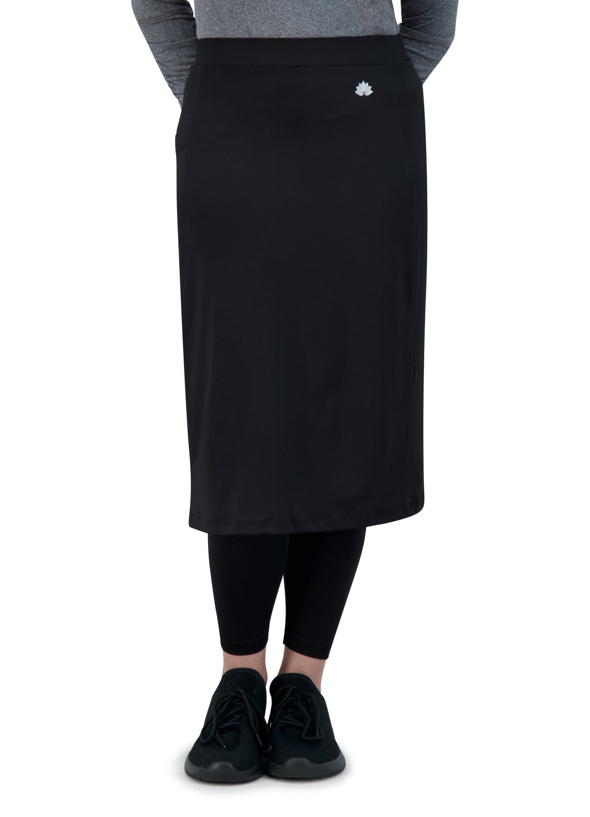 Snoga Athletics black ankle-fit skirt leggings with lotus logo, front view