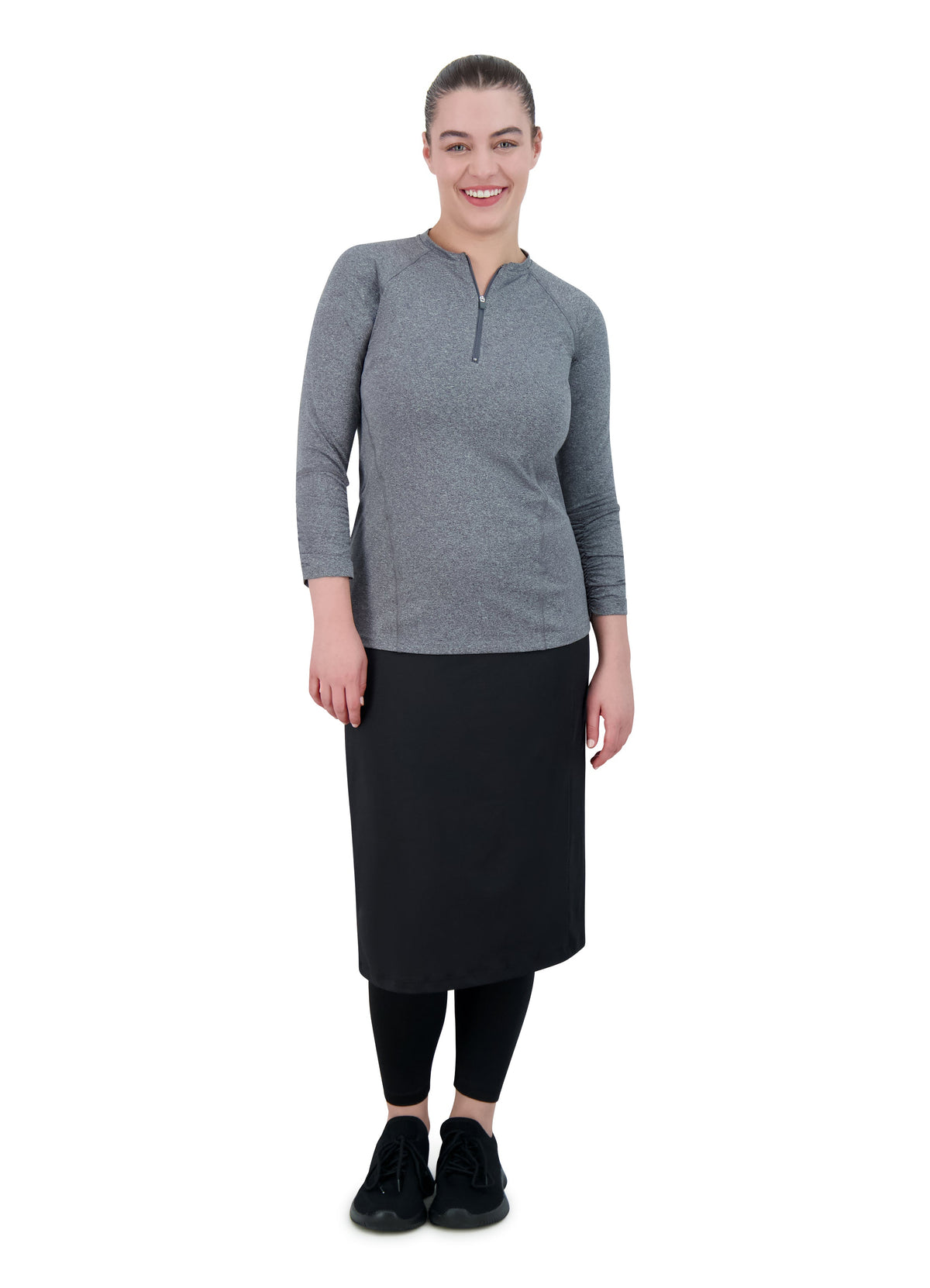Woman modeling Snoga Athletics black ankle-fit modest activewear skirt with leggings and gray top