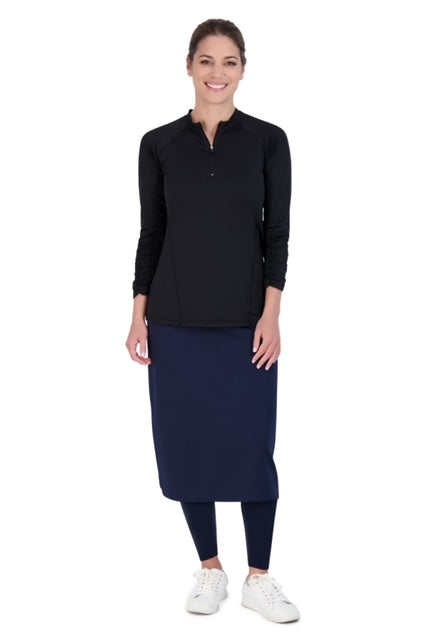 Woman in Snoga Athletics navy ankle midi modest skirt with leggings and black sports top