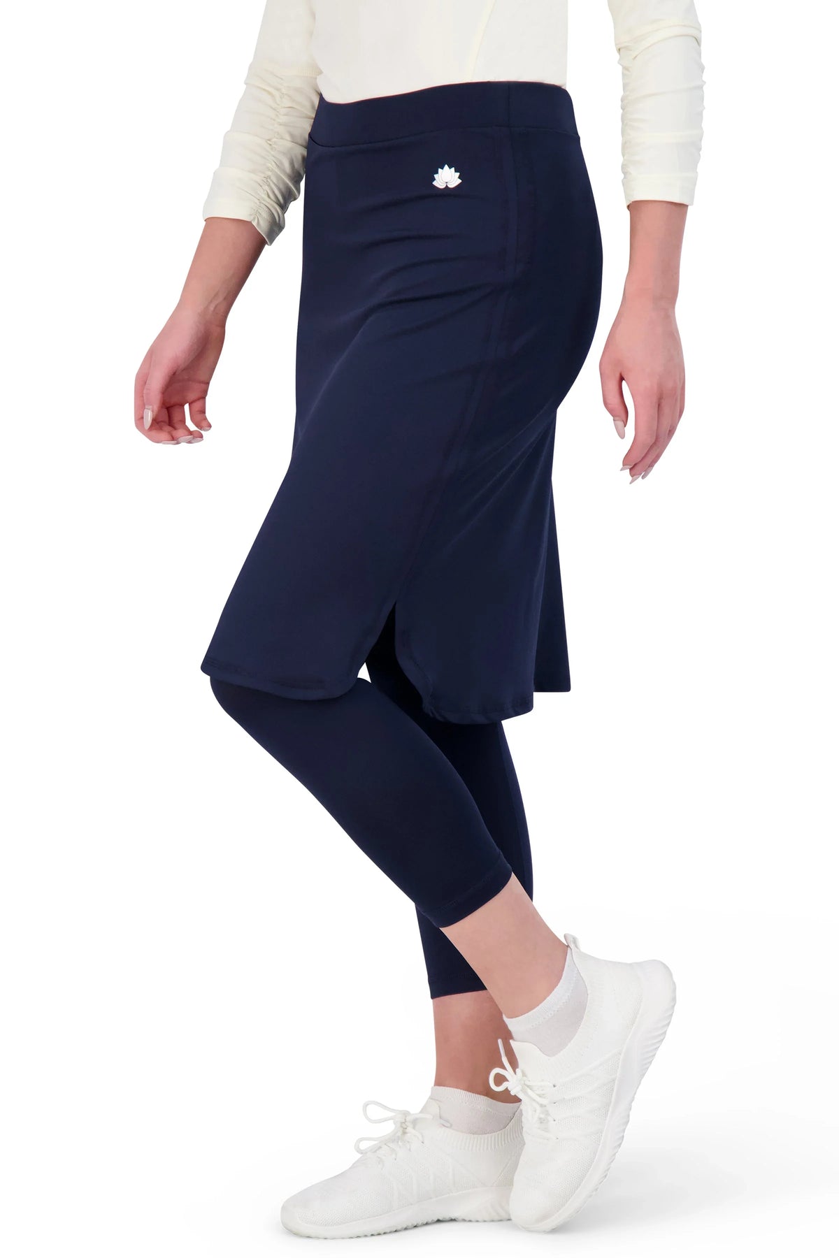 Snoga Athletics navy modest athletic skirt with attached leggings, shirttail hem, on model