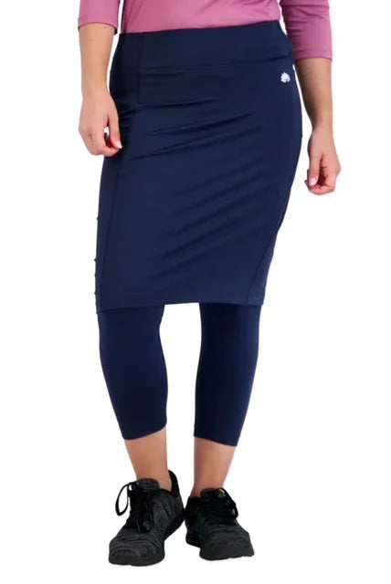 Woman wearing Snoga Athletics navy skirted leggings, modest activewear with pockets