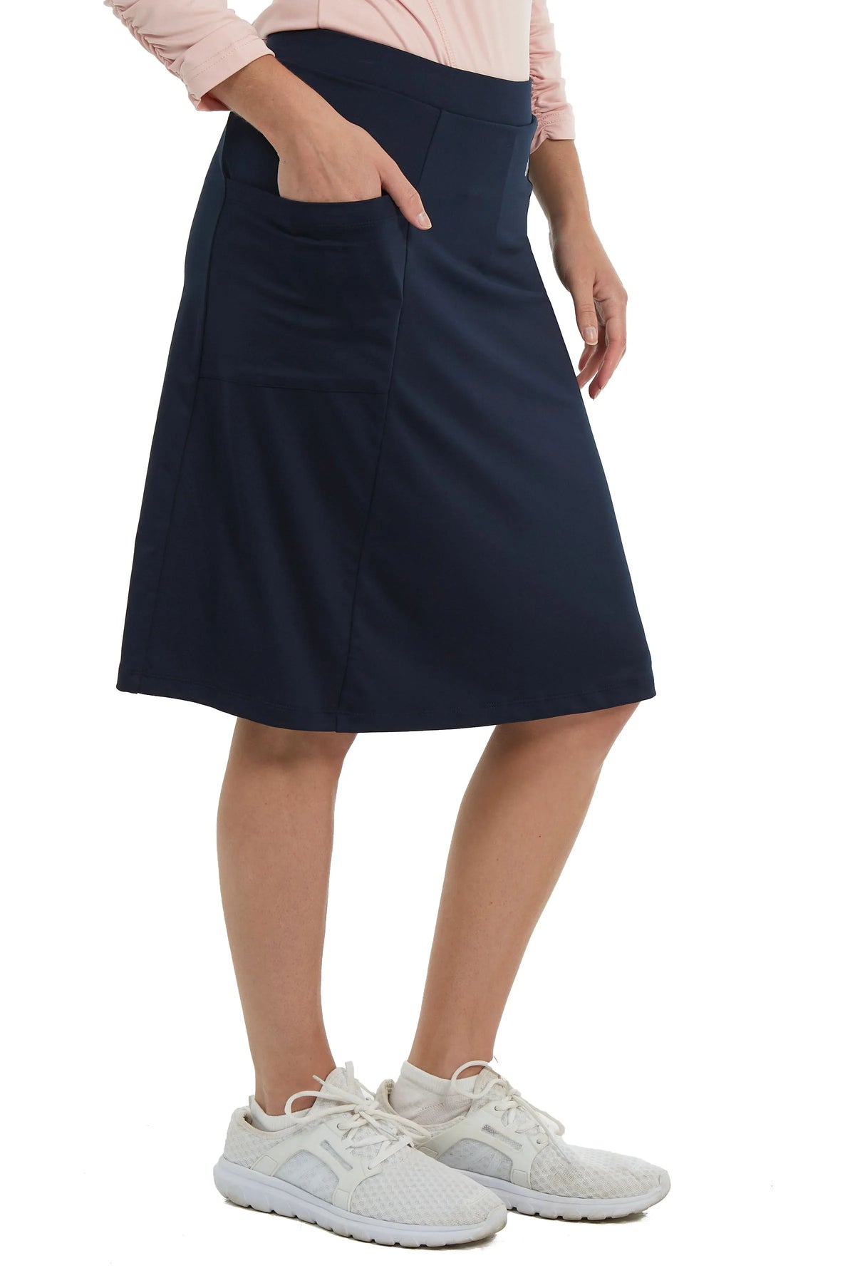 Snoga Athletics navy modest athletic skort with pockets, shown mid-length on model