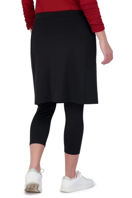 Woman wearing Snoga Athletics black modest activewear skirt with attached leggings