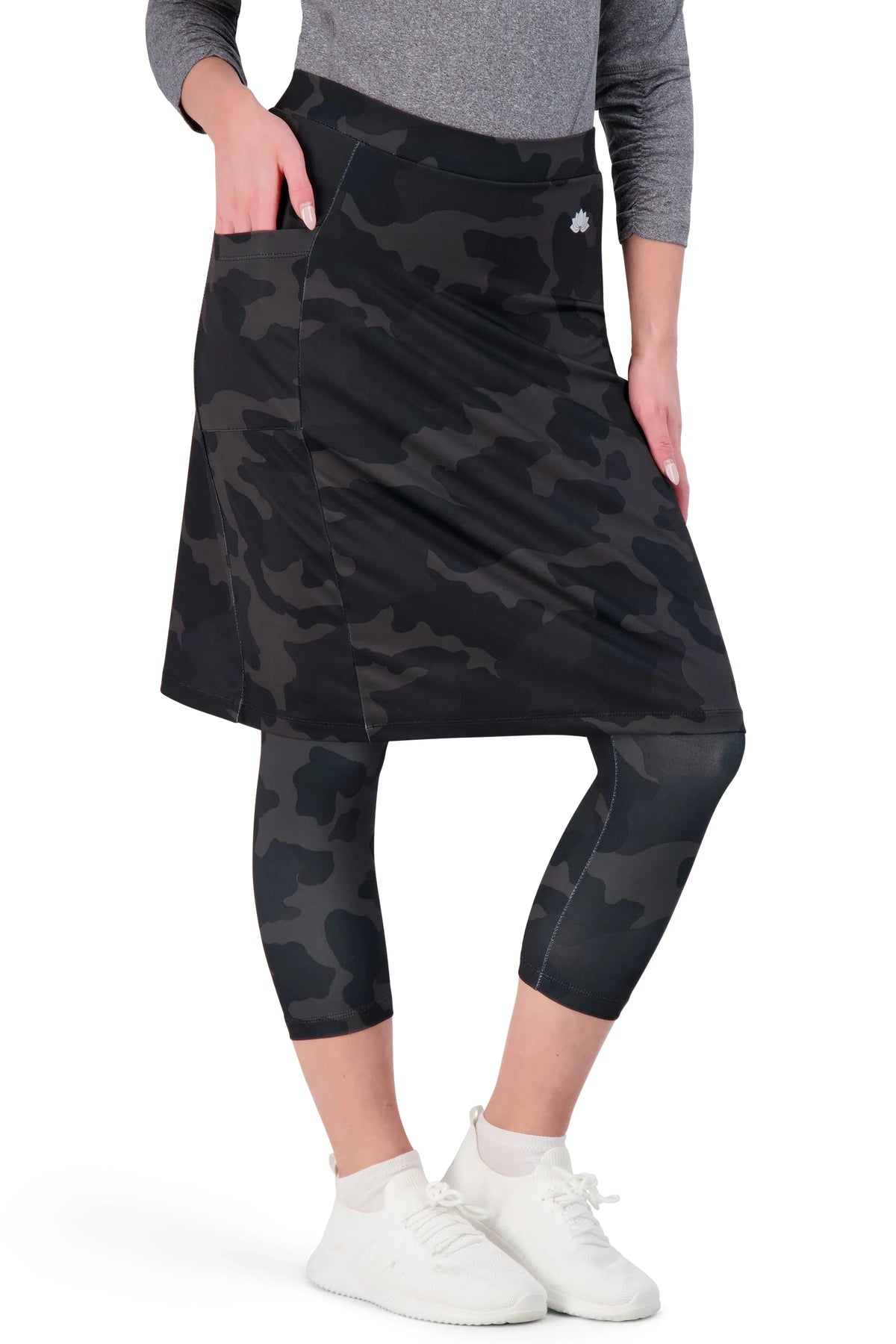 Woman wearing Snoga Athletics black camo modest athletic skirt with leggings