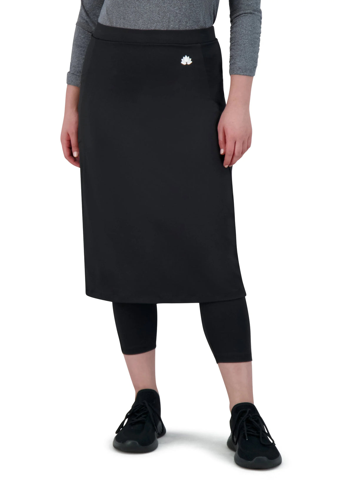 Snoga Athletics black modest athletic skirt with attached leggings, front logo, worn by model