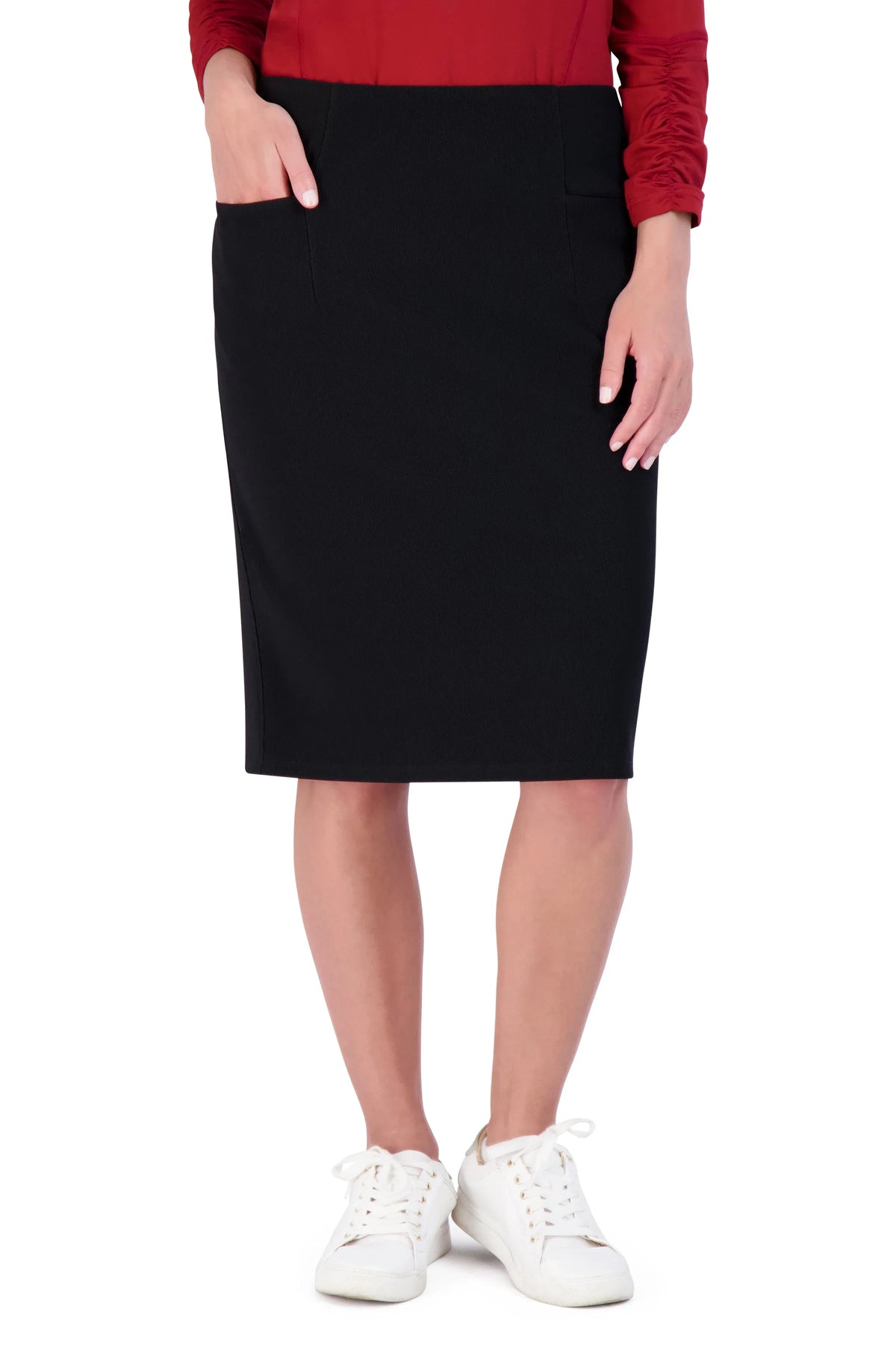 Snoga Athletics black ribbed stretch pencil skirt with pockets, modeled with white sneakers