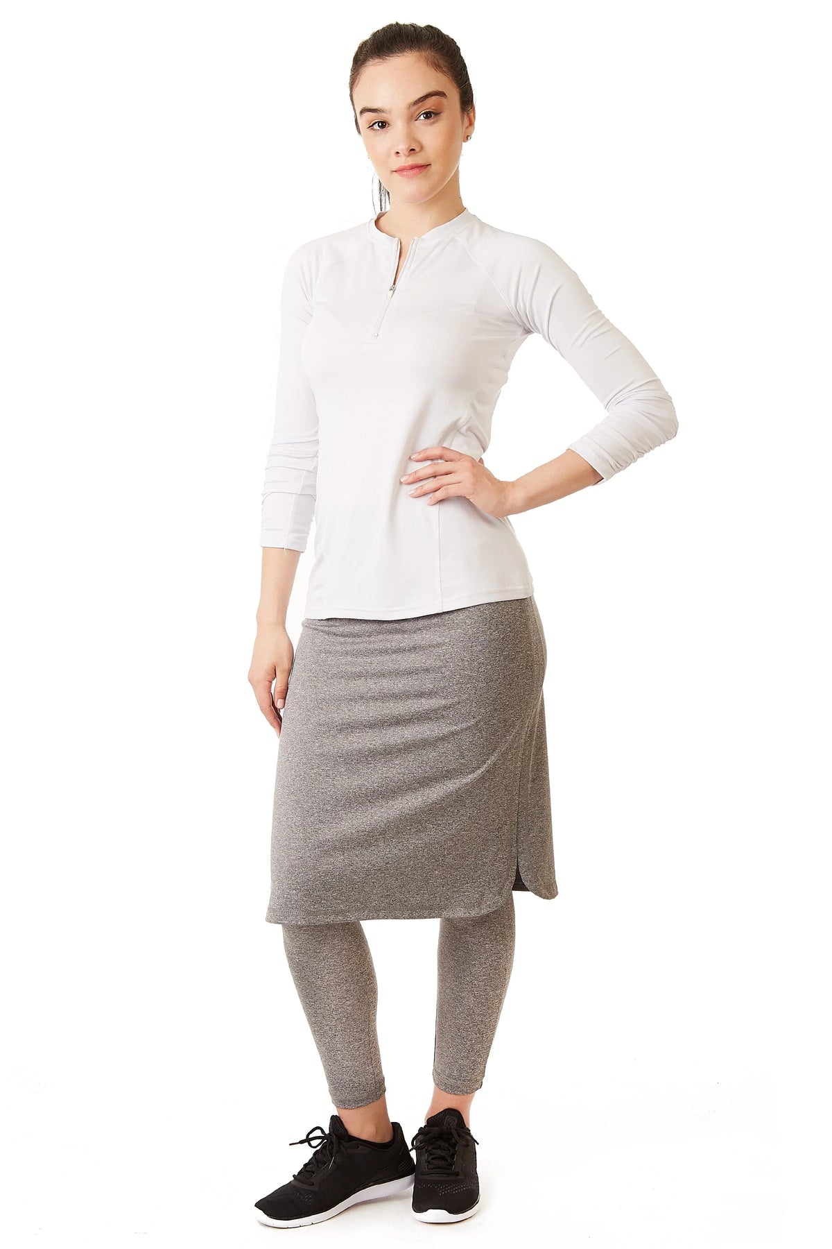 Woman wearing Snoga Athletics heather grey long shirttail skirt with attached leggings