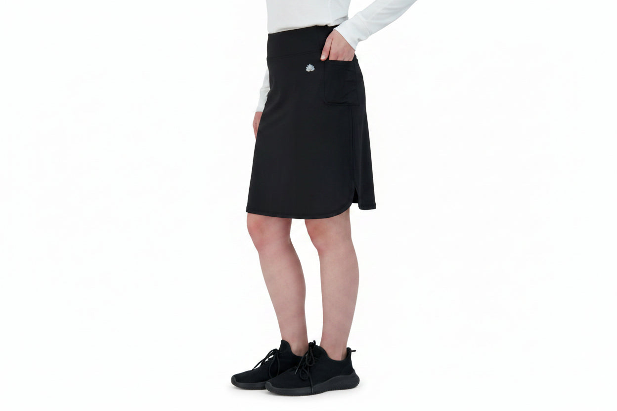 Snoga Athletics black sport pocket skirt with side pocket, worn by woman, activewear style