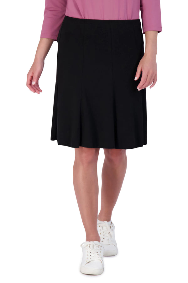 Snoga Athletics black twirly pull-on athletic skirt, knee-length, modeled with sneakers