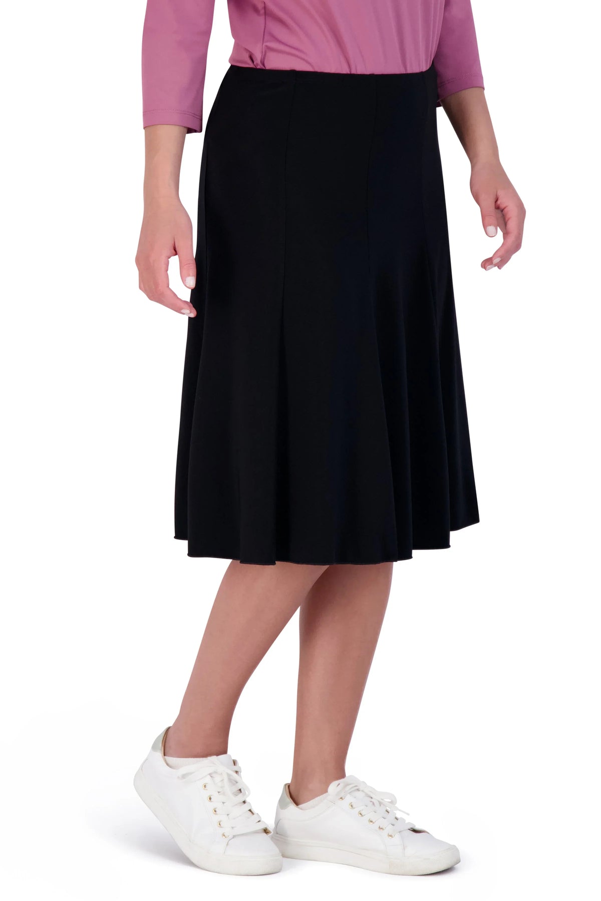 Woman wearing Snoga Athletics black twirly skirt with sneakers and pink top
