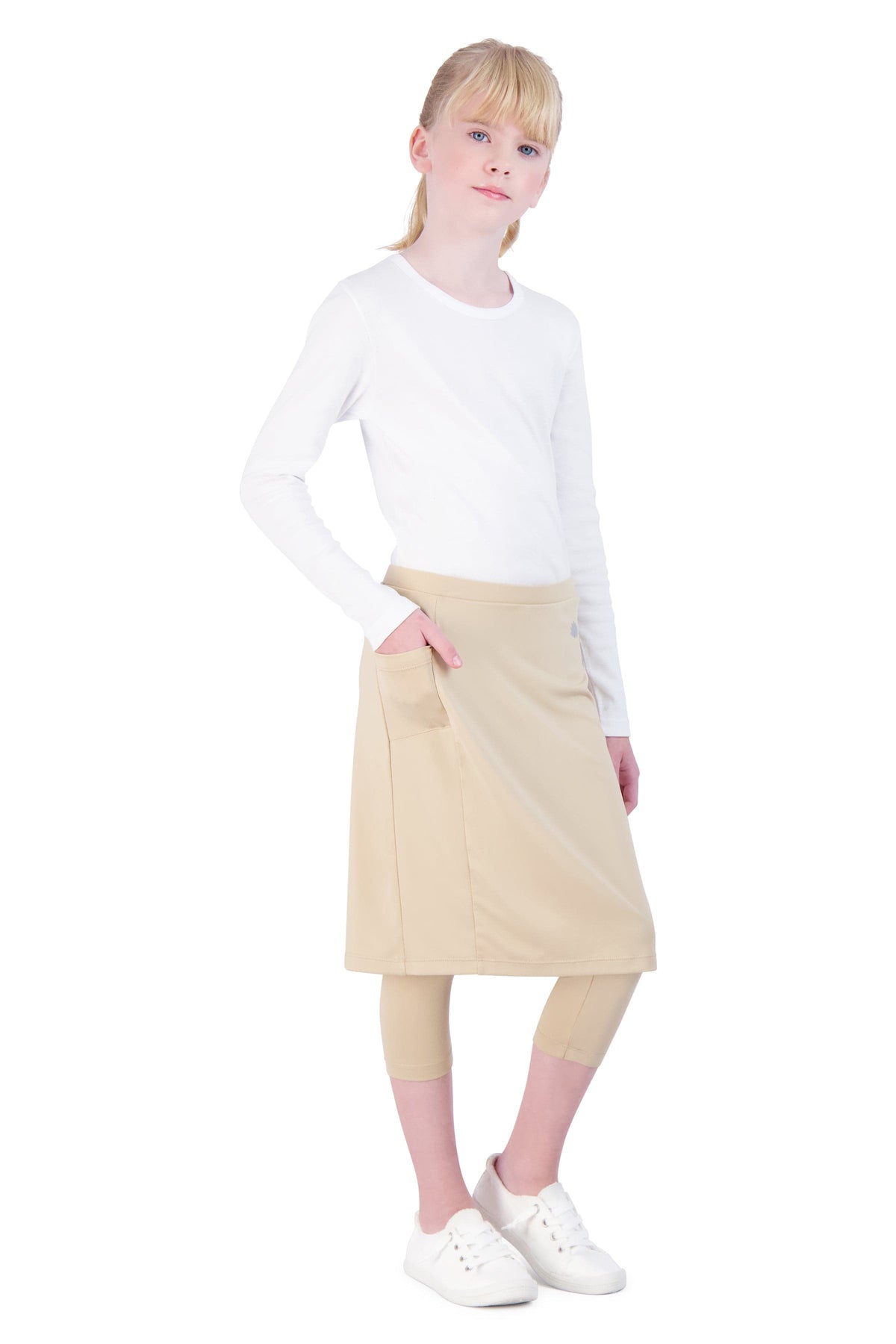Girl modeling Snoga Athletics beige skirted leggings with pocket, modest activewear