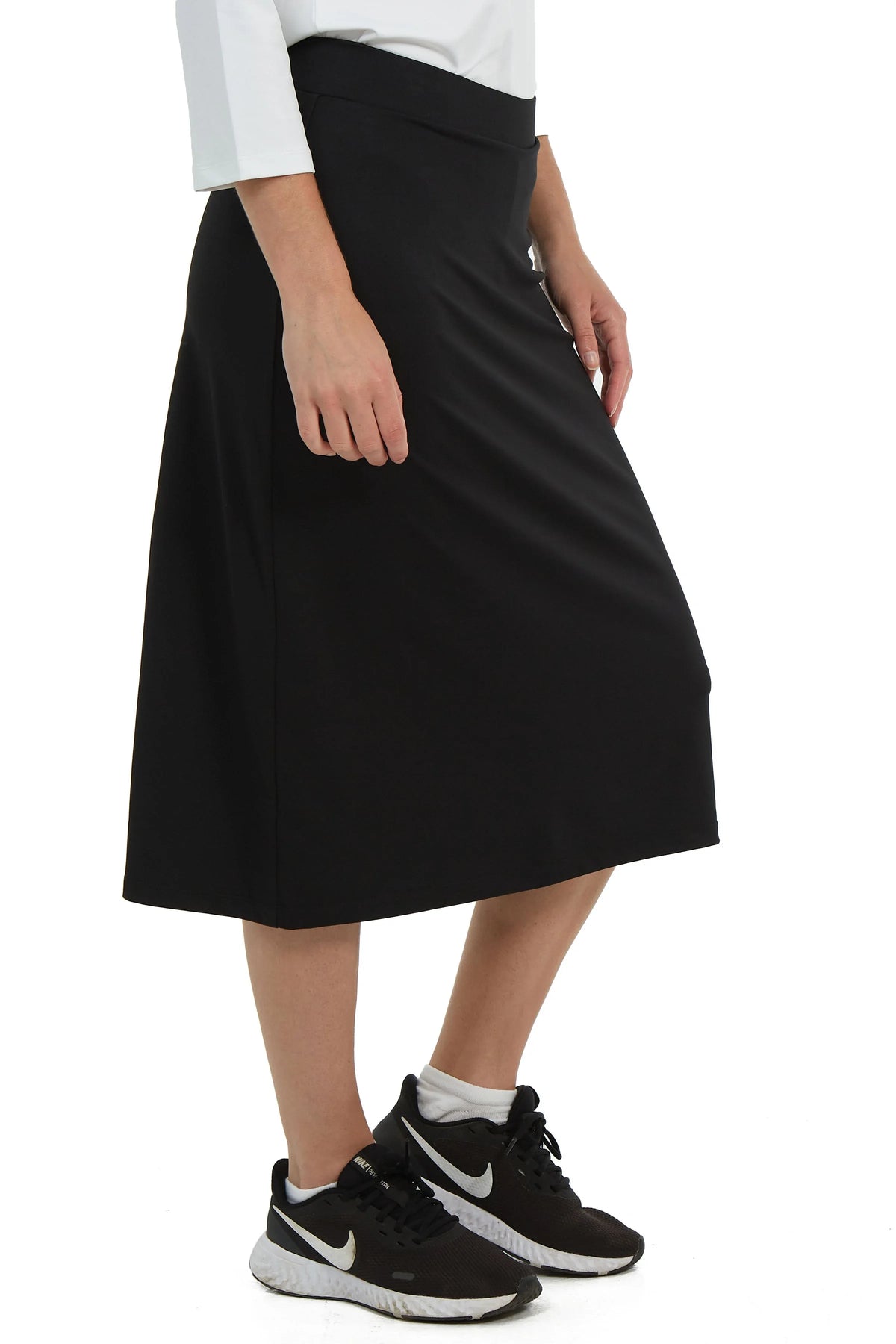 Snoga Athletics black modest athletic skirt modeled with white top and sneakers