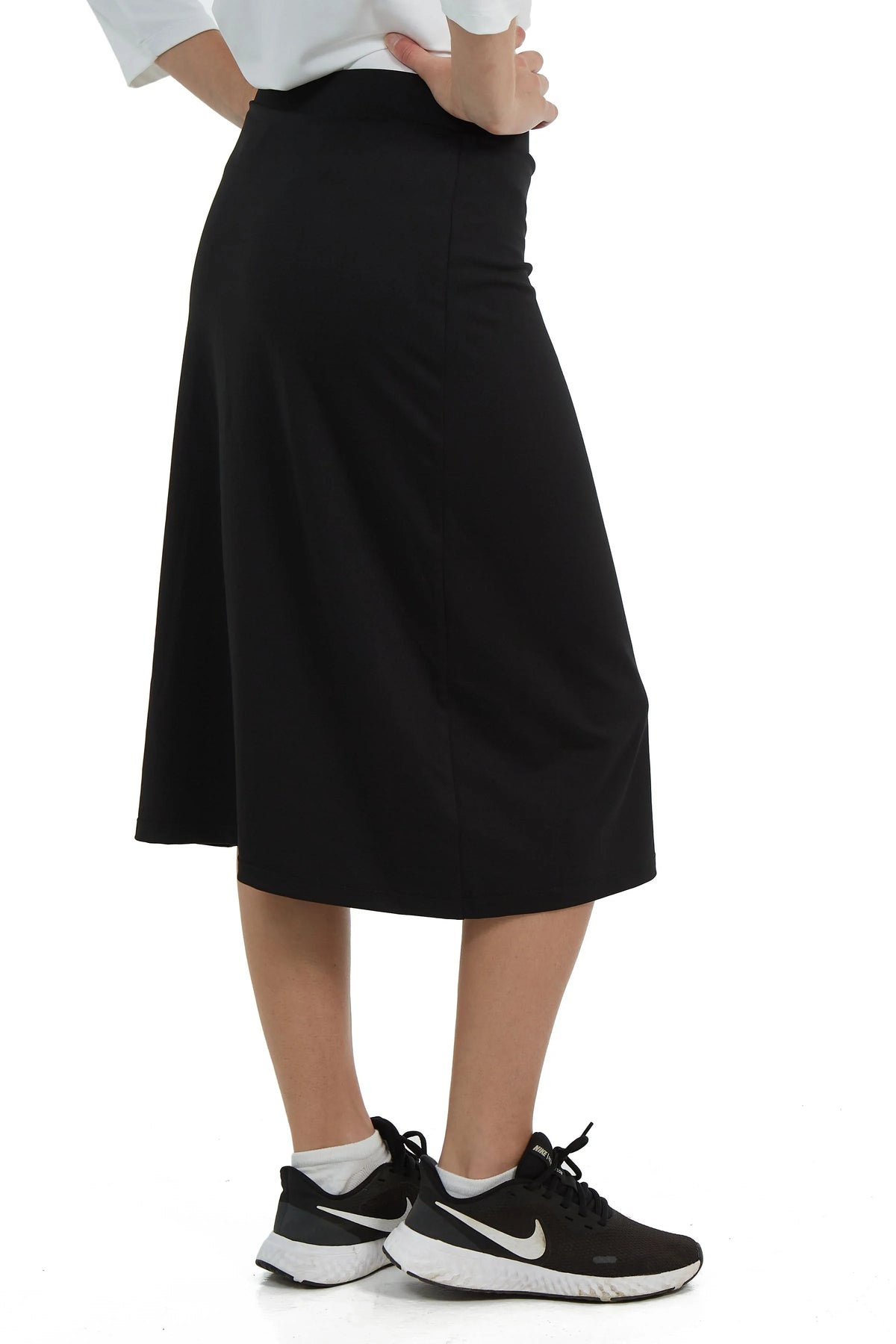 Snoga Athletics black modest athletic skirt worn with sneakers, side view